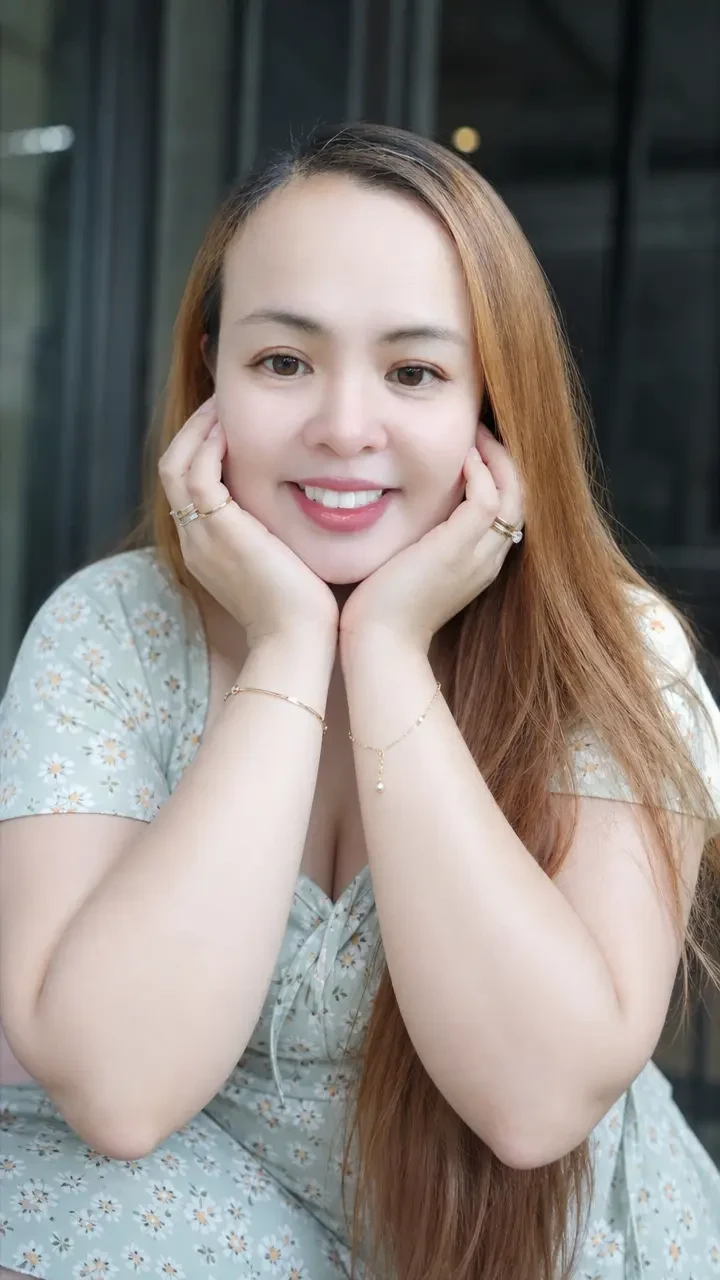 woman with jewelry and floral dress